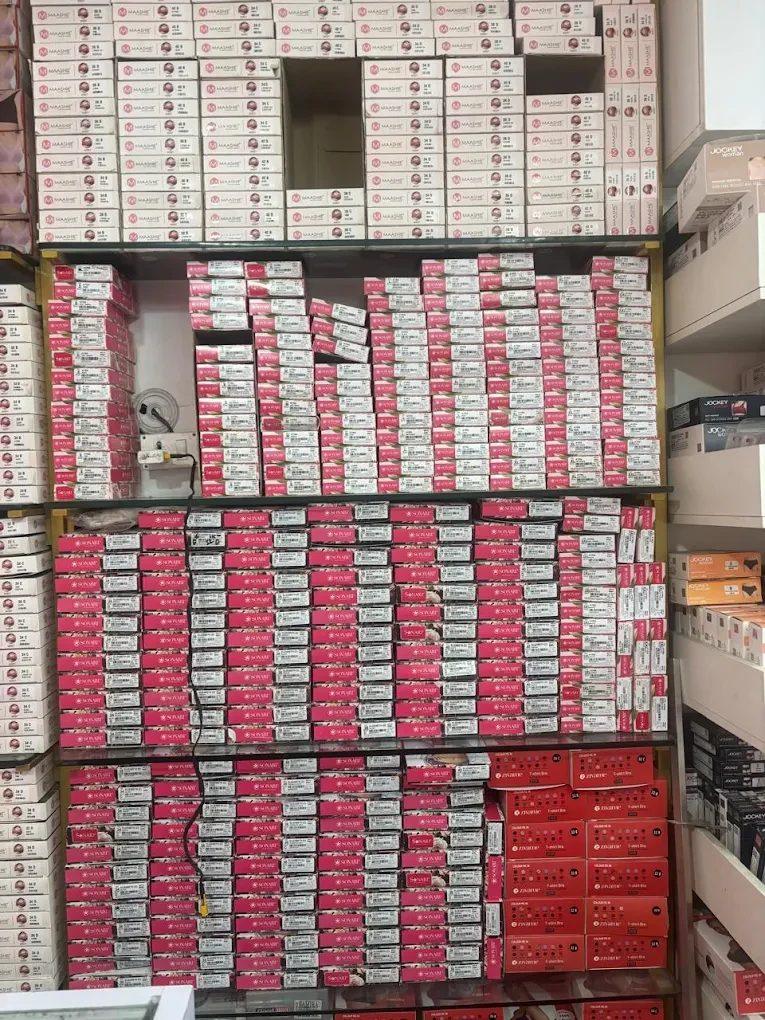 Wall of boxed bras sorted by size